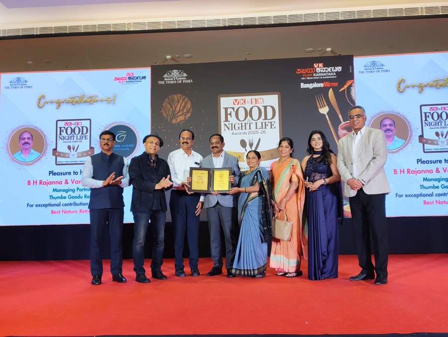 B H Rajanna and Vanaja receiving Best Nature Retreat award on stage